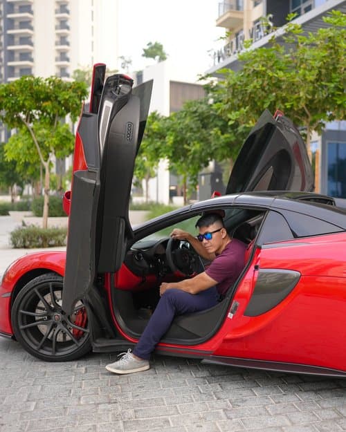 Mike Ke lifestyle photo with sports car